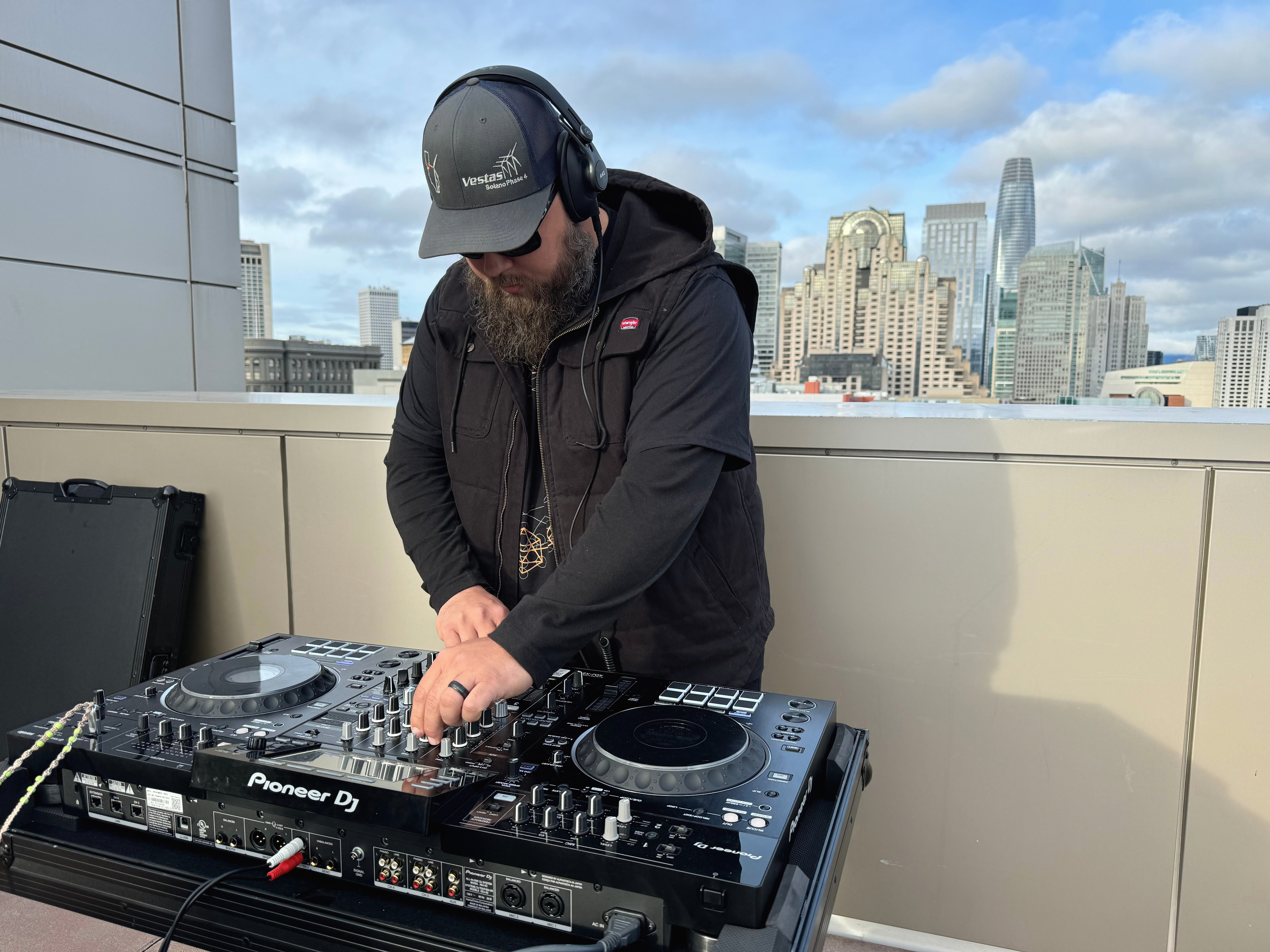 Travis Barnes working at a Pioneer DJ controller